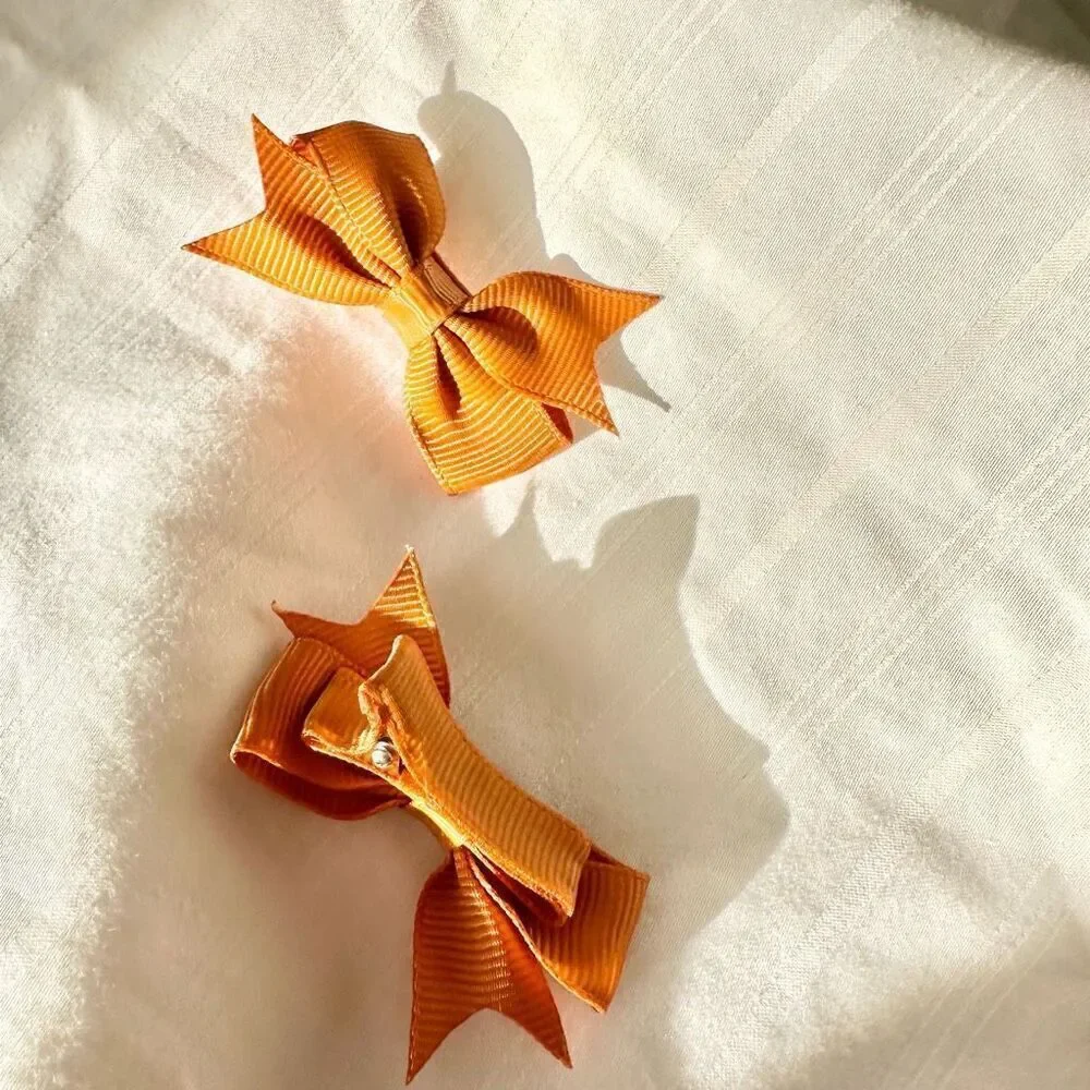 Orange color mini hair bows - for women, babies, dogs, or cats